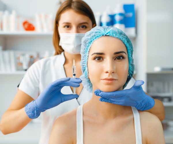 cosmetician-holds-syringe-with-injection-of-botox.jpg